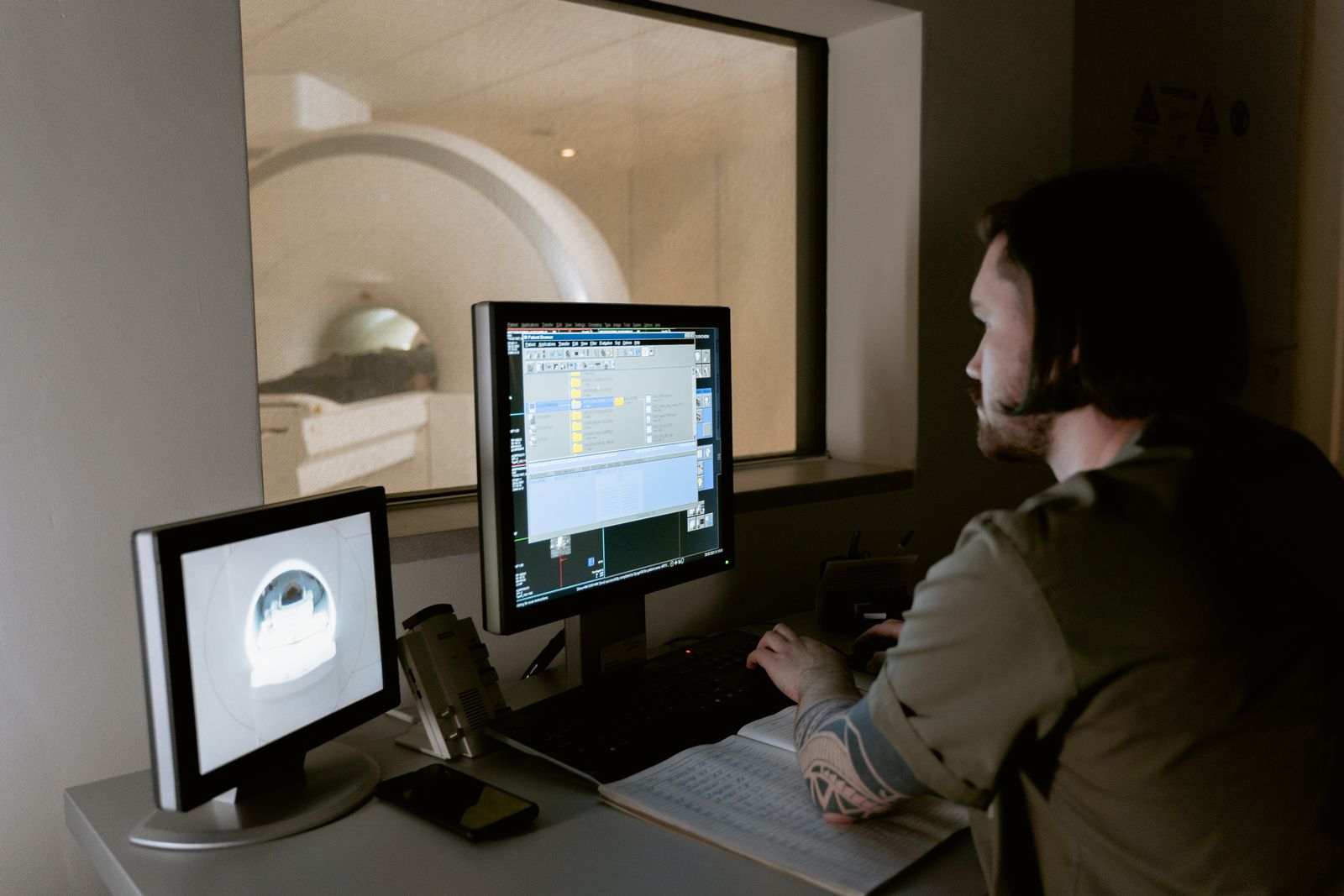 Radiologist reading MRI studies on a PACS workstation
